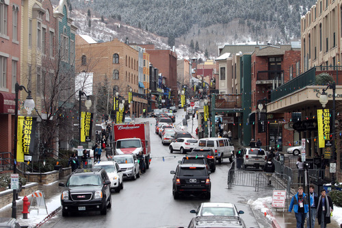 Rick Egan  | The Salt Lake Tribune 

Cars try to make their way up Main Street in Park City, Friday, January 20, 2012.