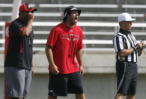 Scott Sommerdorf  |  The Salt Lake Tribune             
Morgan Scalley yells at his safties as they defend a play at Utah football practice, Saturday, August 18, 2012.