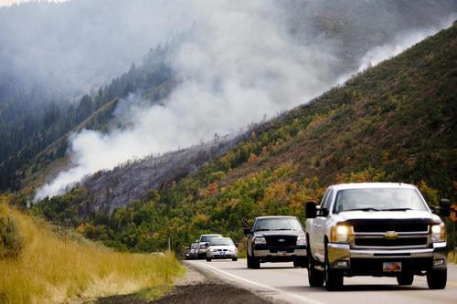 Kim Raff | The Salt Lake Tribune
People travel west on Highway 40 as firefighters battle a new wildfire off the highway outside of Heber in Wasatch County,Utah on August 19, 2012.