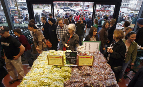 Tribune file photo
Dozens of shoppers lined up at the Trolley Square Whole Foods store on opening day, March 14, 2011, as the company aims to open scores of new stores in 