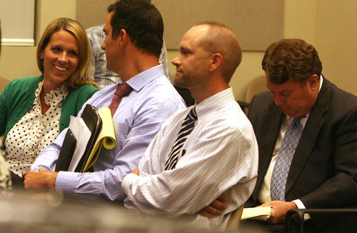 Leah Hogsten  |  The Salt Lake Tribune
l-r Marci Kelley, Andrew Kelley, Greg Wilding and LaVar Christensen listens as residents speak for and against  Andrew Kelley's request to amend his Corner Canyon subdivision plan by removing a development restriction give their opinions at Draper City Hall council chambers August 21, 2012. The Andrew Kelley family wants to lift a development restriction on open space in their backyard near Corner Canyon in Draper, but neighbors worry about the aesthetics and say Draper city ordinances should not be changed.
