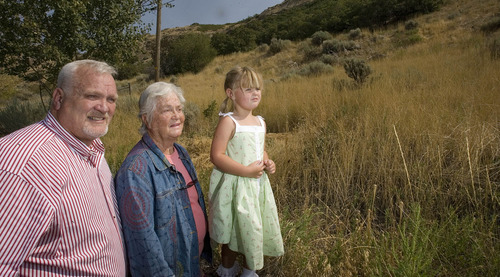 Paul Fraughton |  The Salt Lake Tribune
Three generations of real estate developer M. Kenneth White's descendents -- grandson Kerry Jackson, daughter Joyce Jackson and great-great granddaughter Annie Jackson, 3, look over land   along the foothills of Grandeur Peak that the White family has donated to Salt Lake County to extend the Bonneville Shoreline Trail.