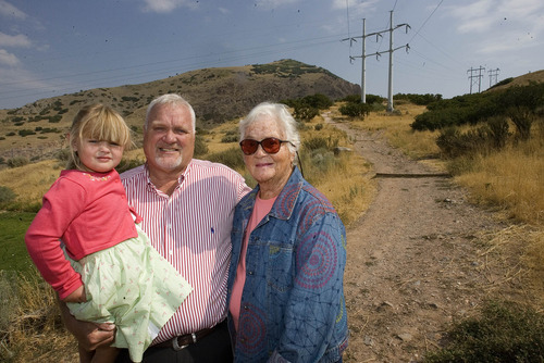 Paul Fraughton |  The Salt Lake Tribune
Holding his granddaughter Annie, Kevin Jackson stands with his mother, Joyce Jackson, at the trailhead for the Bonneville Shoreline Trail near the mouth of Parleys Canyon. The White family donated 18 acres along the foothills of Grandeur Peak to the county, which will extend the Bonneville Shoreline Trail.