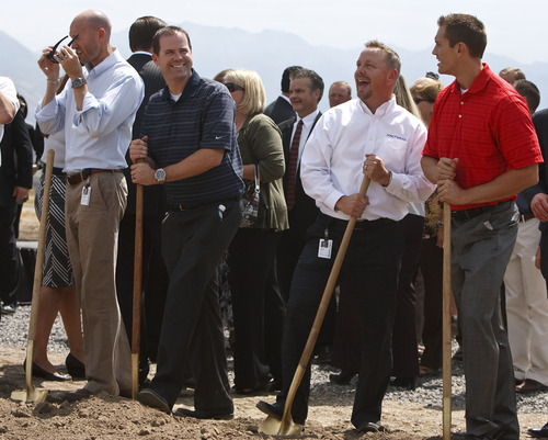 Leah Hogsten  |  The Salt Lake Tribune
Xactware Corporation employees l-r Brandon Harding, Brian Carroll, Scott Parkin and Michael Gratzinger from the accounting division take their turn shoveling dirt and mugging for a fellow employee's camera. Groundbreaking for the new offices of Xactware Corporation August 23, 2012 on West Morning Glory Road in Lehi, whose software is used by contractors, insurance companies and others to estimate building repair costs. The company plans to invest $130 million in a new 250,000-square-foot campus $32 million the company received in tax incentives from the state. The company plans to hire more than 800 people over the next two decades.