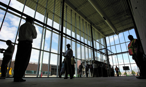 Steve Griffin | The Salt Lake Tribune
Salt Lake County and West Valley City officials get a tour of the Granger High School construction site Wednesday, Aug. 22, 2012, during a back-to-school event. Here, guests stand in the second entry way to the school near the gymnasium. The building is set to open for the 2013-2014 school year.