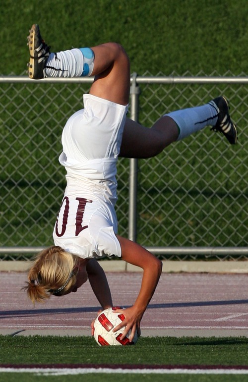 Kim Raff | The Salt Lake Tribune
Jordan High School player Madi Hill does a flip throw in during a game against Murray at Jordan High School in Sandy, Utah on August 23, 2012.