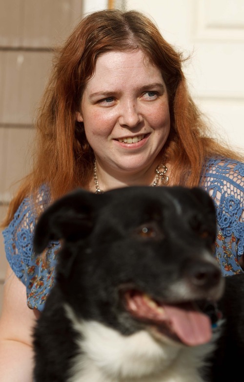 Trent Nelson  |  The Salt Lake Tribune
Lisa Anderson and her dog Swift at her home in West Valley City, Utah Friday, August 10, 2012. Anderson had weight-loss surgery last year to try to get pregnant.