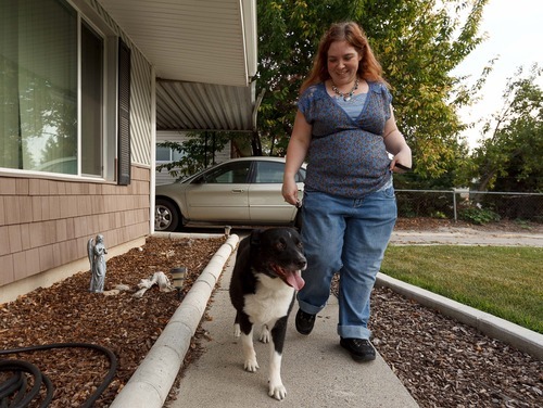 Trent Nelson  |  The Salt Lake Tribune
Lisa Anderson walks her dog Swift near her home in West Valley City, Utah Friday, August 10, 2012. Anderson had weight-loss surgery last year to try to get pregnant.