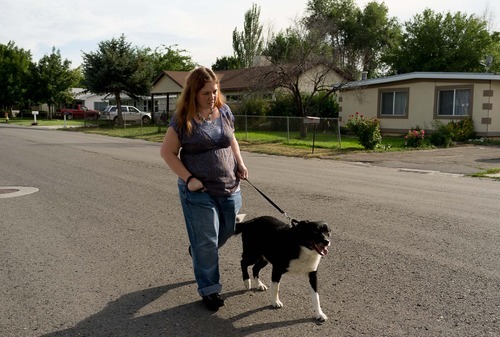 Trent Nelson  |  The Salt Lake Tribune
Lisa Anderson walks her dog Swift near her home in West Valley City, Utah Friday, August 10, 2012. Anderson had weight-loss surgery last year to try to get pregnant.