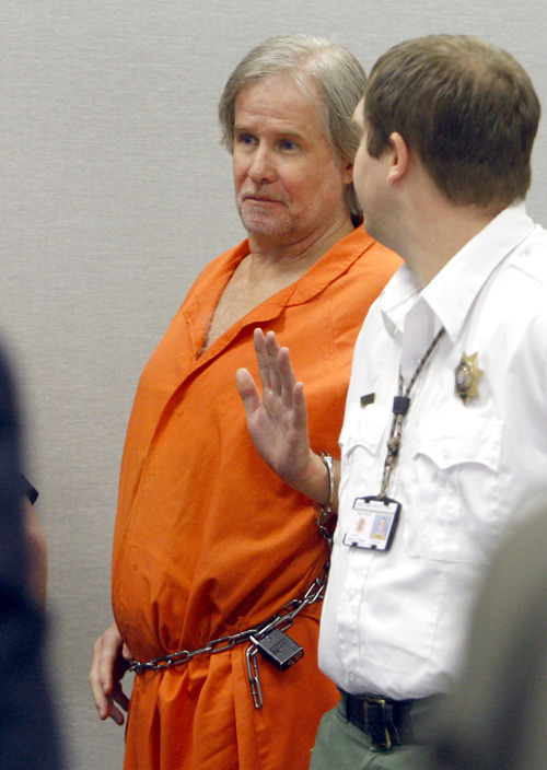 Tribune file photo
John Pinder waves at family members as he exits the court room following an appeals hearing in 2011.