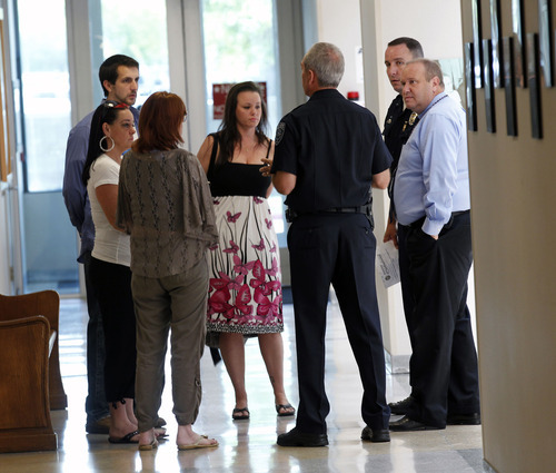 Al Hartmann  |  The Salt Lake Tribune
Family members of Nikole Bakoles speak to Unified Police prior to start of press conference Thursday August 23. Police recently identified bones that were found by duck hunters in 1998 off I-80 near the Great Salt Lake as those of Nikole Bakoles. The family spoke at a press conference before taking the remains back to Washington state.