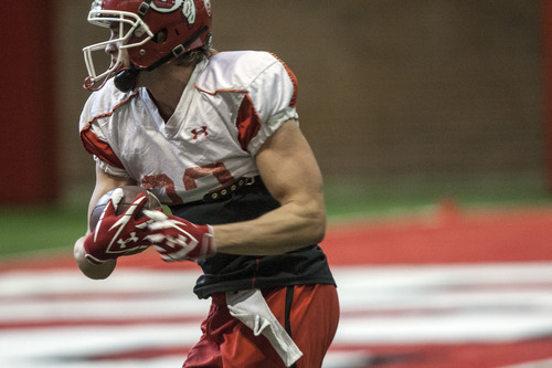 Chris Detrick  |  The Salt Lake Tribune
Utah Utes wide receiver Sean Fitzgerald (83) runs the ball during a practice at the Spence Eccles Field House Thursday April 12, 2012.