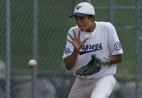 Scott Sommerdorf  |  The Salt Lake Tribune             
Jacksonville third baseman Moises Pichardo gathers in this bouncing ball during first inning play. The Branchburg (NJ) Bulldogs defeated the Jacksonville (FL) Ospreys 7-5 to win the Babe Ruth World Series, Saturday, August 25, 2012 in Murray.