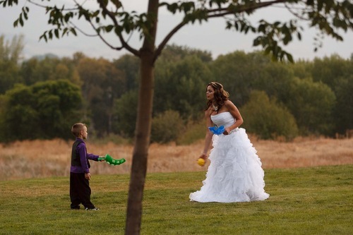 Trent Nelson  |  The Salt Lake Tribune
Jen Comer plays catch with her son, T.J. Carver, at her wedding reception. Comer married Daniel Comer in Huntsville, Utah, Aug. 18, 2012.