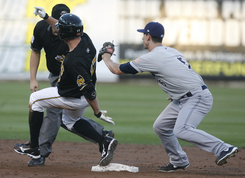 Rick Egan  | The Salt Lake Tribune 

Anthony Conteras is late with the tag, as Salt Lake's Peter Bourjos gets to second base for a double, in baseball action, Salt Lake vs, the Tucson Padres, at Springmobile Ballpark, Monday, August 27, 2012.