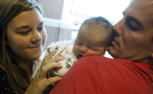 Francisco Kjolseth  |  The Salt Lake Tribune
Ashlee and Tom Peterson of Lehi welcomed their first child, Carter, into the world Tuesday at University Hospital. The Petersons chose to have Carter circumcised after reading about related health benefits.