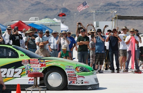 Trent Nelson  |  The Salt Lake Tribune
Spectators take photographs at the starting line at the 64th annual Speed Week at the Bonneville Salt Flats.