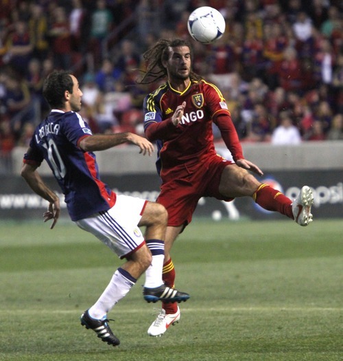Rick Egan  | The Salt Lake Tribune 

Real Salt Lake's Kyle Beckerman (5)  goes for the ball, along with Nick LaBrocca, Chivas USA, in MLS soccer action in Sandy, Saturday, March 24, 2012.