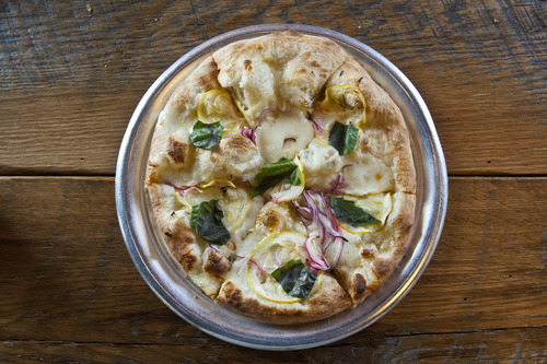 Chris Detrick  |  The Salt Lake Tribune
Limone Pizza ($8.95) made with olive oil, mozzarella, parmigiano reggiano, lemons, red onions, garlic and basil at Pizzeria Limone in Cottonwood Heights.