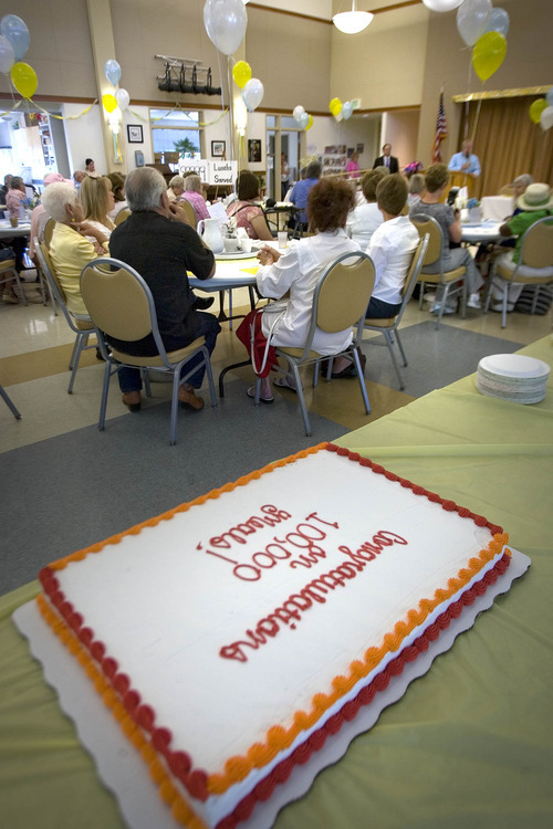 Paul Fraughton | Salt Lake Tribune
Seniors listen to a short program before eating their lunch at the Taylorsville Senior Center. The center celebrated the 100,000th lunch served there with balloon decorations, gift baskets and a commemorative cake. Wednesday, August 29, 2012