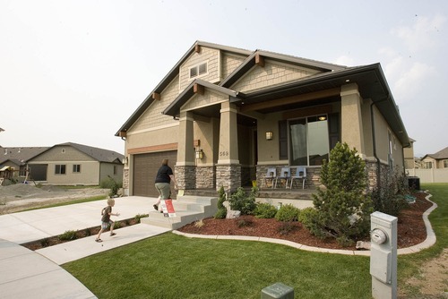 Paul Fraughton | Salt Lake Tribune
Visitors approach the front door of  a home built by students in the Canyons Technical Educational Center's program. The home at 569 E. Rosebowl Court, in Sandy  is part of the Parade of Homes home show.
 Wednesday, August 15, 2012