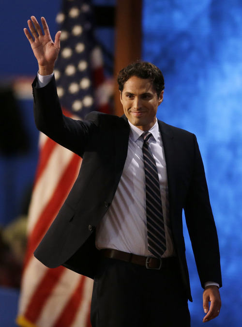 Republican presidential nominee Mitt Romney's son Craig Romney waves after speaking to delegates during the Republican National Convention in Tampa, Fla., on Thursday, Aug. 30, 2012. (AP Photo/Lynne Sladky)
