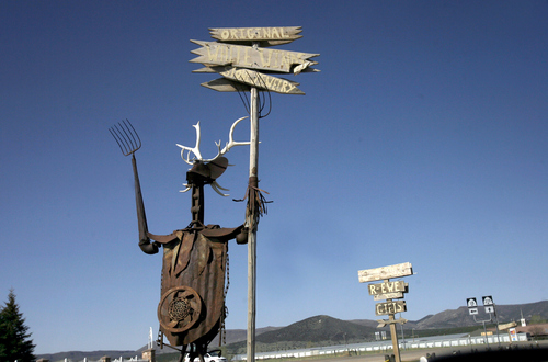 Rick Egan  | The Salt Lake Tribune 

Wacky sign guy, in Enterprise, Utah.