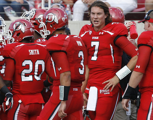 Scott Sommerdorf  |  The Salt Lake Tribune             
Backup QB Travis Wilson congratulates QB Jordan Wynn on his TD pass to give Utah an early 7-0 lead. Utah held a 7-0 lead over Northern Colorado early in the second quarter on Jordan Wynn's 10 yard TD pass to Jake Murphy, Thursday, August 30, 2012.