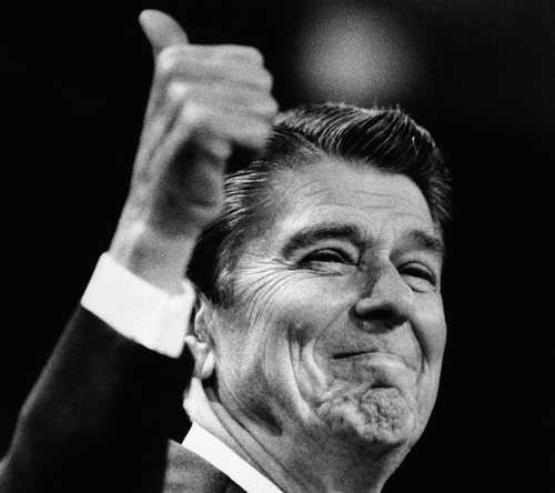 FILE - In this Aug. 23, 1984 black-and-white file photo, President Ronald Reagan gives the thumbs up gesture during his acceptance speech at the final session of the 1984 Republican National Convention in Dallas. Mitt Romney did not mention the war in Afghanistan, where 79,000 US troops are fighting, in his speech accepting the Republican presidential nomination on Thursday. The last time a Republican presidential nominee did not address war was 1952, when Dwight Eisenhower spoke generally about American power and spreading freedom around the world but did not explicitly mention armed conflict. Below are examples of how other Republican nominees have addressed the issue over the years, both in peacetime and in war.   (AP Photo/Peter Southwick, File)