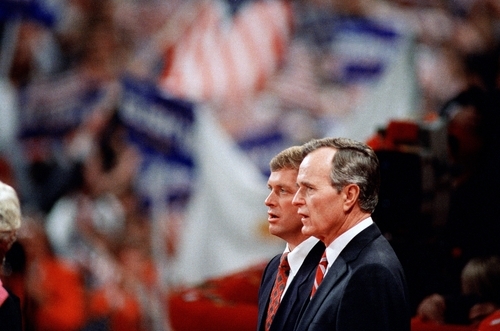 FILE - In this Aug. 18, 1988 file photo, Republican presidential candidate George H.W. Bush and his running mate Sen. Dan Quayle, R-Ind.,  stand together during the final night of the Republican National Convention in New Orleans. Mitt Romney did not mention the war in Afghanistan, where 79,000 US troops are fighting, in his speech accepting the Republican presidential nomination on Thursday. The last time a Republican presidential nominee did not address war was 1952, when Dwight Eisenhower spoke generally about American power and spreading freedom around the world but did not explicitly mention armed conflict. Below are examples of how other Republican nominees have addressed the issue over the years, both in peacetime and in war.   (AP Photo/Bob Daugherty, File)