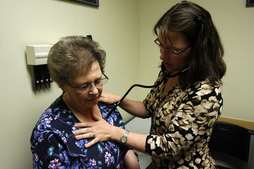 Francisco Kjolseth  |  The Salt Lake Tribune
Physician Mary Tipton checks Dolores Drayer's heart at CopperView Medical Center in South Jordan. Drayer, 69, of Herriman, has worked to control her diabetes after being diagnosed last April, and has lost 40 lbs. Tipton's clinic is part of the federally-funded Beacon project, which helps clinics go paperless and use patient data to drive care.
