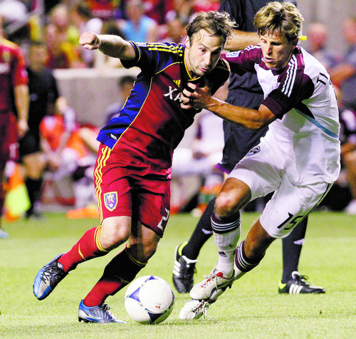 Rick Egan  | The Salt Lake Tribune 

Real Salt Lake midfielder Ned Grabavoy (20) tries to get by Wells Thompson (15) of the Rapinds, in MLS action Real Salt Lake vs the Colorado Rapids, Saturday, July 21, 2012.