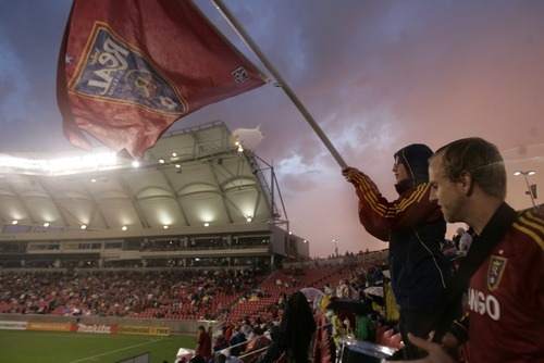 Kim Raff | The Salt Lake Tribune
(right) Preston Butcher and Roger Machado stand in a thunderstorm during a rain delay and wait for the game between Real Salt Lake and D.C. United to resume at Rio Tinto Stadium in Sandy, Utah on September 1, 2012.