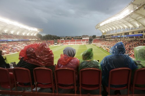 Kim Raff | The Salt Lake Tribune
Fans brave a thunder shower that delayed the Real Salt Lake and D.C. United game at Rio Tinto Stadium in Sandy, Utah on September 1, 2012.