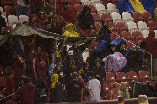 Kim Raff | The Salt Lake Tribune
Fans brave a thunder shower that delayed the Real Salt Lake and D.C. United game at Rio Tinto Stadium in Sandy, Utah on September 1, 2012.