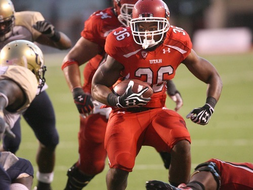Paul Fraughton | The Salt Lake Tribune
Utah running back Jarrell Oliver runs the ball for a short gain to the four-yard line against Northern Colorado at Rice Eccles Stadium in Salt Lake City on Thursday, Aug. 30, 2012.