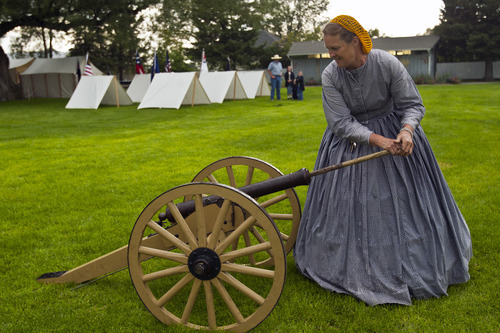 Chris Detrick  |  The Salt Lake Tribune
Jeri Hansen, of Fairfield, loads a replica canon during Camp Floyd Days at Camp Floyd State Park in Fairfield Saturday September 1, 2012. The event will allow visitors to experience camp life and participate in several activities performed by soldiers of Johnston's Army. Events include reenactments, encampments, stagecoach rides (Monday 12pm – 2pm), firearm and cannon demonstrations, marches, drills, 1861 period games, and photos in period uniform. The events will be conducted 10 a.m. to 4 p.m. on both days. Standard museum entrance fees are $2 per person or $6 per family.
