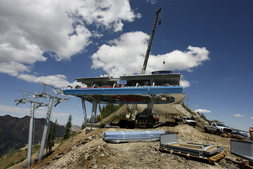Rick Egan  | The Salt Lake Tribune 
A crane lifts pieces into place for the new Little Cloud chairlift at Snowbird Ski & Summer Resort. The high-speed quad lift will replace a 32-year-old fixed-grip two-seater and will feature a 90-degree turn at the ridgetop unloading station, capable of dispersing riders in three directions.