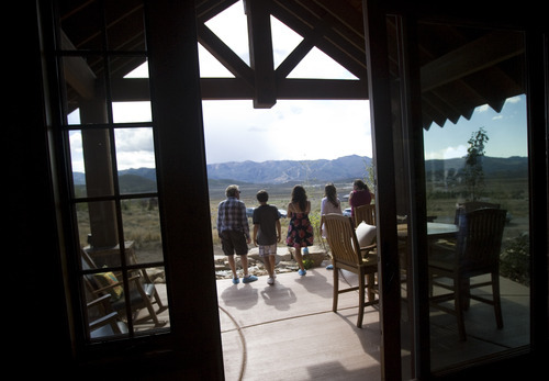 Kim Raff |  The Salt Lake Tribune
People walk on the patio of the 4,500-square-foot home on Dakota Trail in the Promontory during the Park City Showcase of Homes on September 2, 2012.