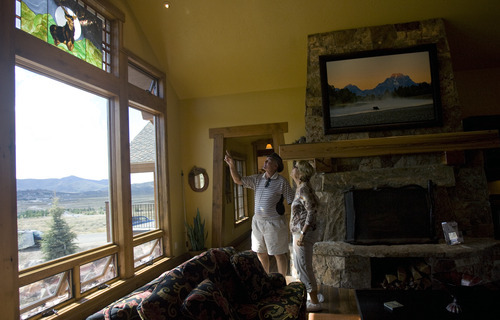 Kim Raff | The Salt Lake Tribune
Bob and Sandy Hindy admire a stained glass window in the den of the 4,500-square-foot home on Dakota Trail in the Promontory in Park City Utah during the Park City Showcase of Homes on September 2, 2012.