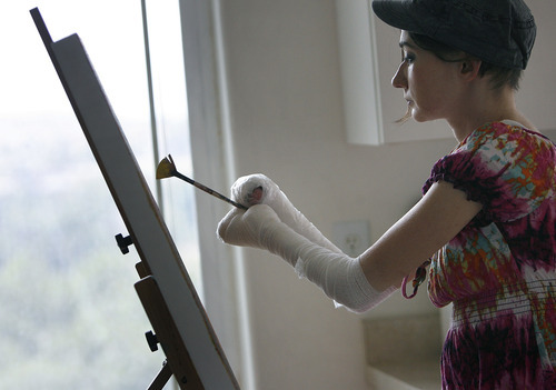 Scott Sommerdorf  |  The Salt Lake Tribune             
Jamie Hartley, 34, paints at her home in Alpine to distract herself from the pain of her rare and deadly skin disorder. Hartley is a Utah delegate to the Democratic National Convention. Because of her disorder, health care is her top issue. She paints to distract herself from the pain in her home in Alpine, Utah.