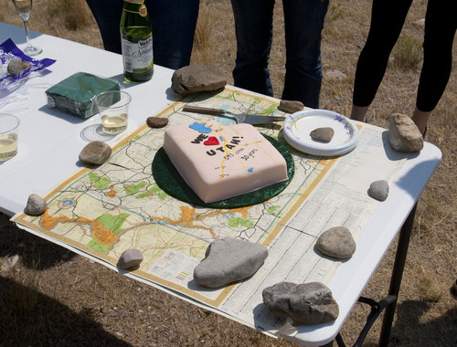 Steve Griffin |  The Salt Lake Tribune
A cake sits on top of the map the Ken and Brenda Gallacher family has used to keep track of their 30-year quest to visit 600 Utah towns and cities.
