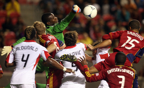 Kim Raff | The Salt Lake Tribune
Real Salt Lake players try and connect with the ball as D.C. United goal keeper Bill Hamid punches the ball in the air during a corner kick at Rio Tinto Stadium in Sandy on Sept. 1, 2012.