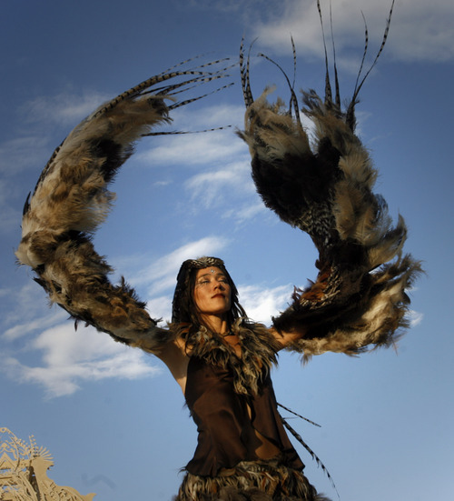 Rick Egan  | The Salt Lake Tribune 
Ildiko dances with feathers at Burning Man in the Black Rock Desert, Nev., on Thursday, Aug. 30, 2012.