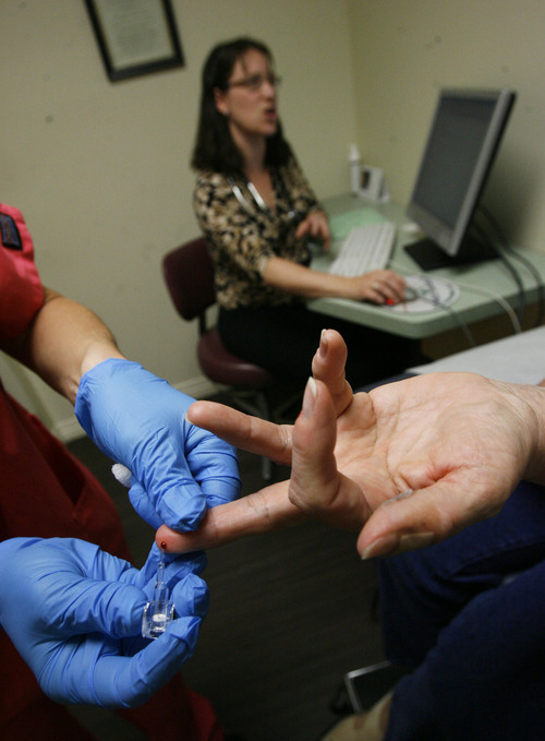 Francisco Kjolseth  |  The Salt Lake Tribune
Dolores Drayer, 69, of Herriman gets her finger pricked for a blood sugar test as physician Mary Tipton adds notes to her electronic medical record. Tipton's clinic is part of the federally-funded Beacon project, which helps clinics go paperless and use patient data to drive care. It's early in the project, but it already appears to be improving outcomes.