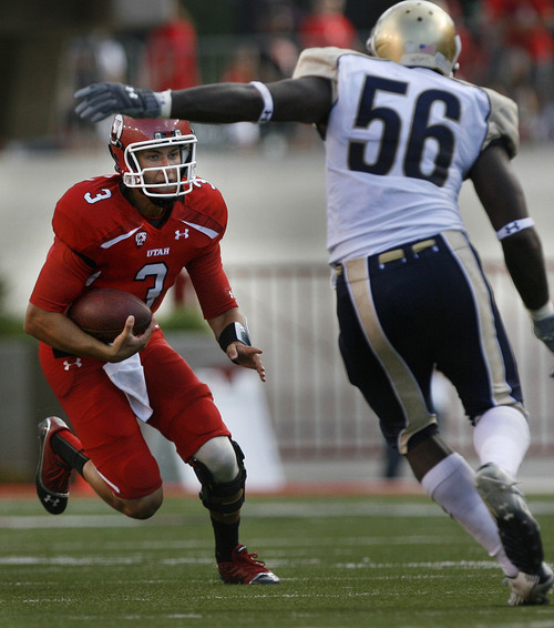 Scott Sommerdorf  |  The Salt Lake Tribune             
Utah QB Jordan Wynn scrambles for yardage during first half play. Defending fvor No. Colo. is LB Clarence Bumpas. Utah held a 7-0 lead over Northern Colorado early in the second quarter on Jordan Wynn's 10 yard TD pass to Jake Murphy, Thursday, August 30, 2012.