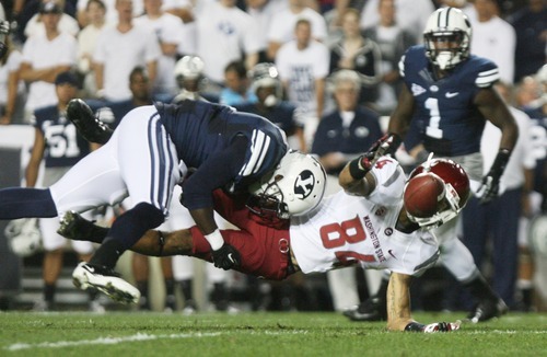 Kim Raff | The Salt Lake Tribune
Brigham Young Cougars defensive back Jordan Johnson (6) hits Washington State Cougars wide receiver Gabe Marks (84) while he attempts a catch during BYU's home opener at LaVell Edwards Stadium in Provo on Aug. 30, 2012.