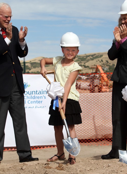 Rick Egan  |  The Salt Lake Tribune 
Aumberlee Davis, a 10-year-old undergoing treatment for leukemia, takes the first scoop of dirt at the groundbreaking ceremony for the new George S. and Dolores Doré Eccles Outpatient Services Building on Thursday.
