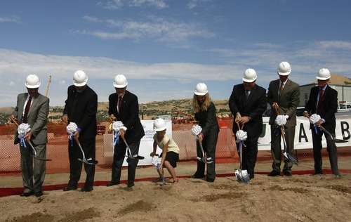 Rick Egan  |  The Salt Lake Tribune 
Officials take the first scoop of dirt as Primary Children's Medical Center holds a groundbreaking ceremony for the new George S. and Dolores Doré Eccles Outpatient Services Building on Thursday.