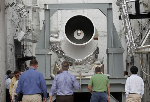 Al Hartmann  |  The Salt Lake Tribune
Alliant Techsystems employees and guests look over the GEM-60 solid rocket motor before  testing Thursday morning September 6 at ATK's testing facility west of Brigham City.   The 60-inch diameter graphite epoxy motor is a commercially provided low-cost propulsion system.